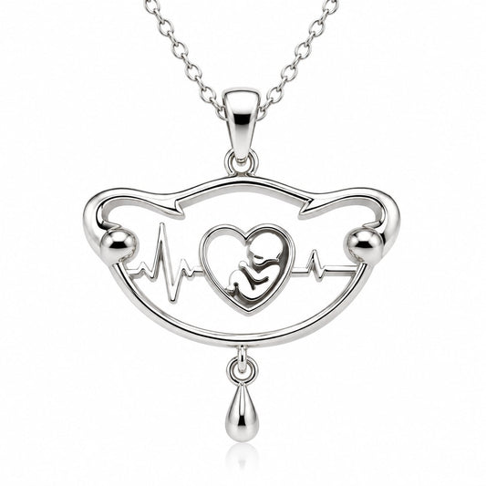 White gold version of The First Heartbeat pendant with baby and heartbeat detail
